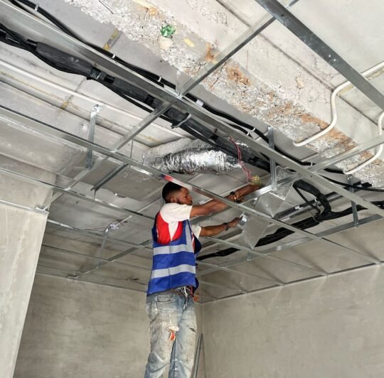 Sato Engineering professionals coordinating a technical project